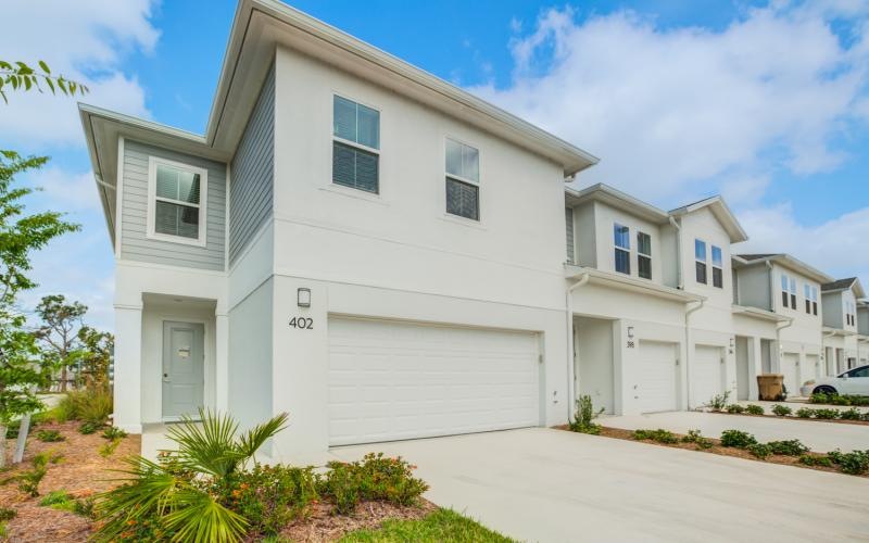 a white house with a garage