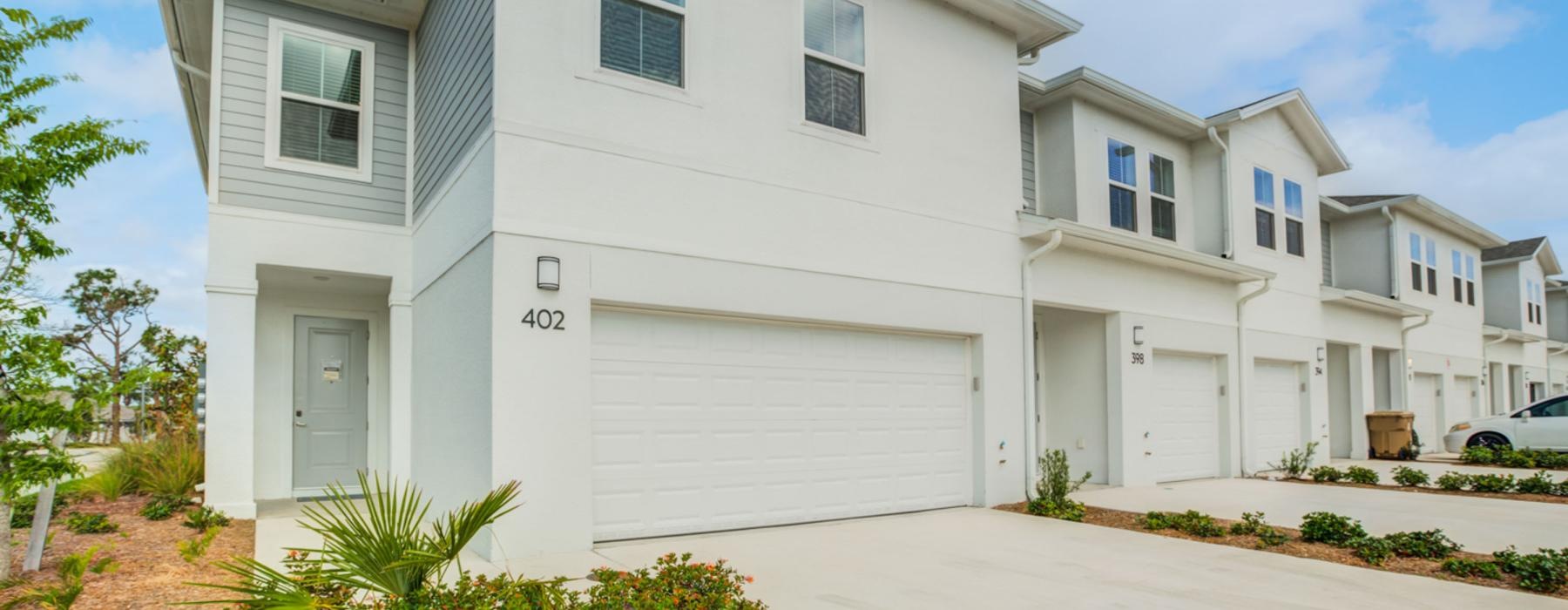 a white house with a driveway