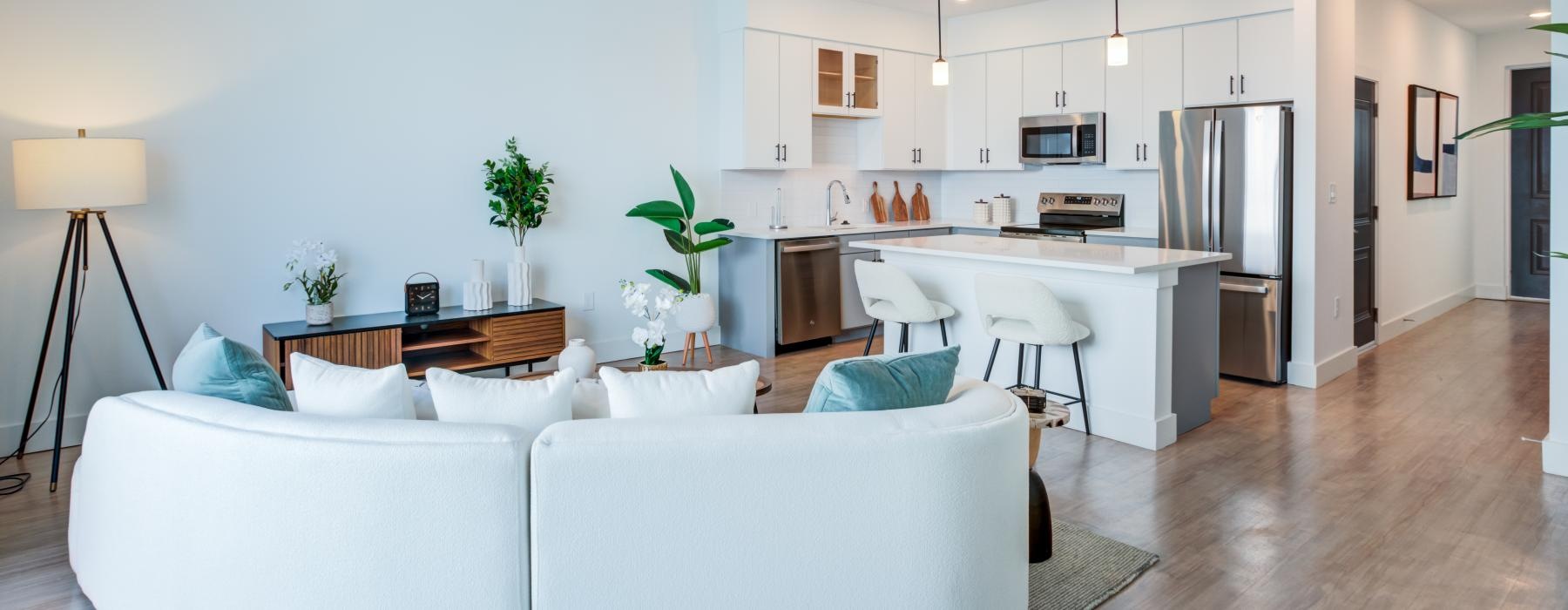 a living room with a large kitchen